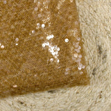 Sequins sur tulle résille ambre
