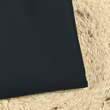 Sergé de coton bleu nuit contrecollé beige