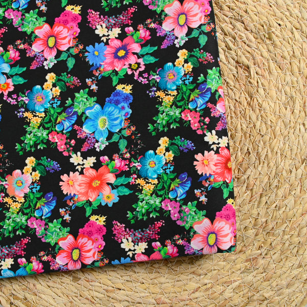 Sergé de coton et viscose champs de fleurs fond noir