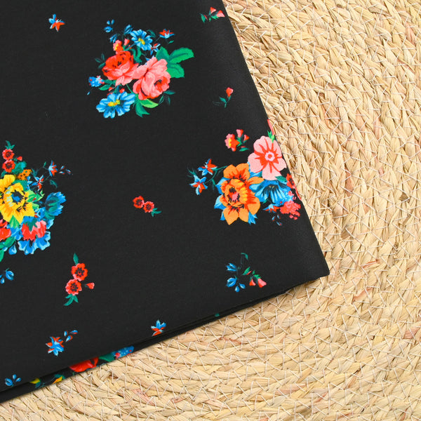 Sergé de coton et viscose fleurs colorées fond noir