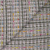 Tweed de polyester doré ligne multicolore fond blanc et rose clair