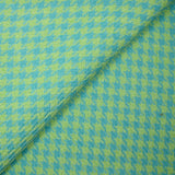 Tweed de polyester pied de poule anis fond turquoise