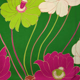 Twill de viscose imprimé en fleurs anis et fuchsia fond vert prairie