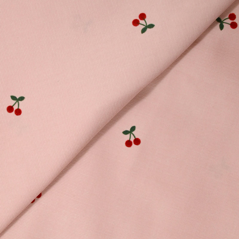 Velours de coton côtelé imprimé cerise fond rose