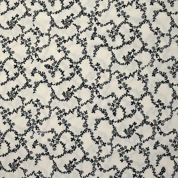 Viscose imprimée chaîne de fleurs fond blanc cassé