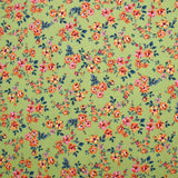 Viscose imprimée fleurs Pétunia fond vert