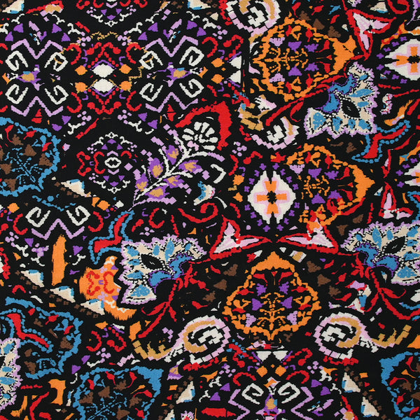 Viscose imprimée frénésie orange, rouge et violet fond noir