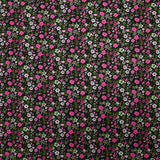 Voile de coton imprimé digital prairie de petites fleurs fuchsia et vert pomme sur fond noir