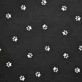 Piqué de coton imprimépattes de chien blanches sur fond noir Coupon 45x45 cm