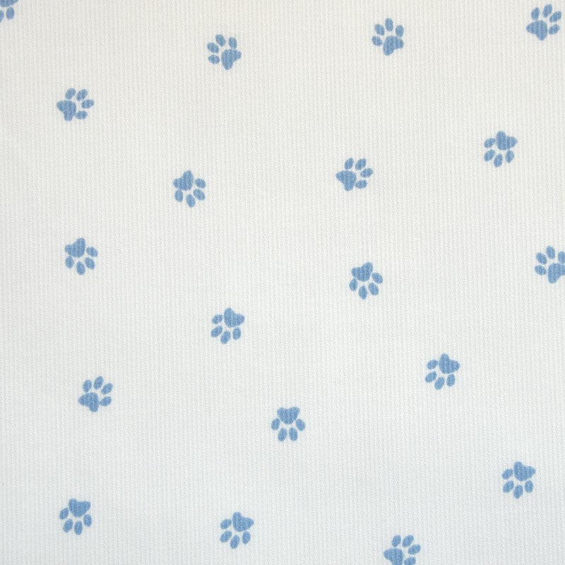 Tissus Piqué de coton imprimé pattes de chien bleues sur fond blanc