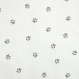 Tissus Piqué de coton imprimé pattes de chien grises sur fond blanc