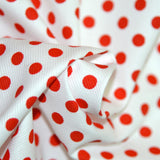 Tissus Piqué de coton milleraies imprimé pois rouge sur fond blanc