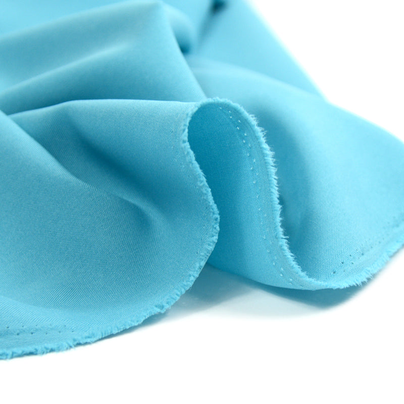 Tissu burlington polyester turquoise clair