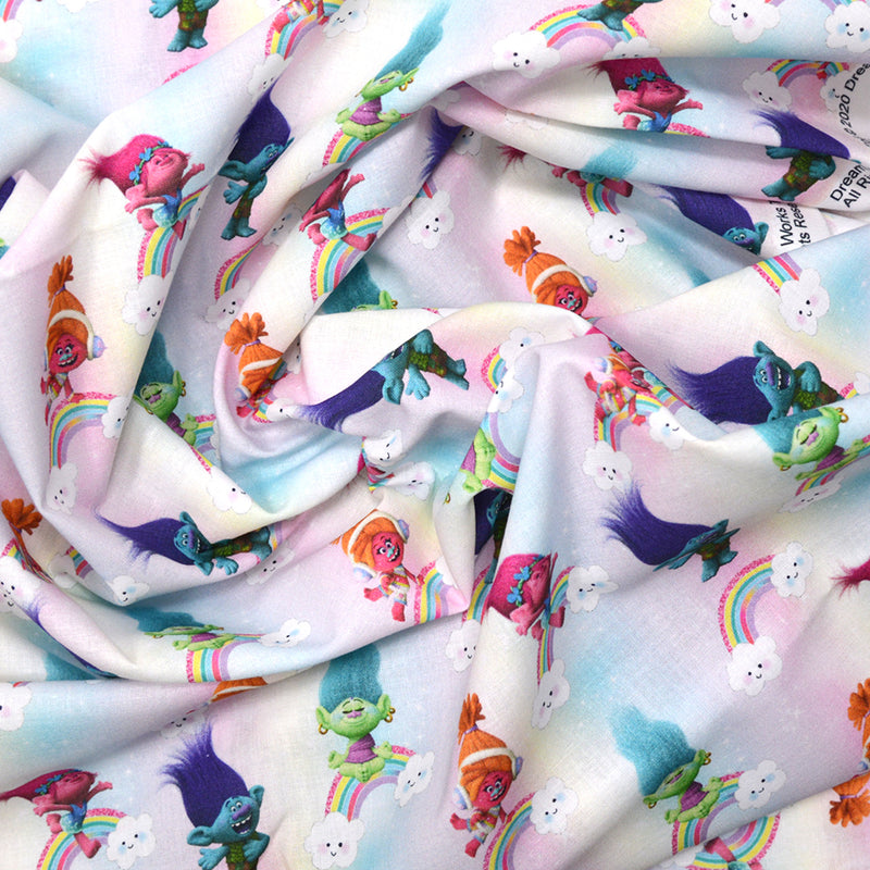 Popeline coton Trolls arc-en-ciel fond multicolore