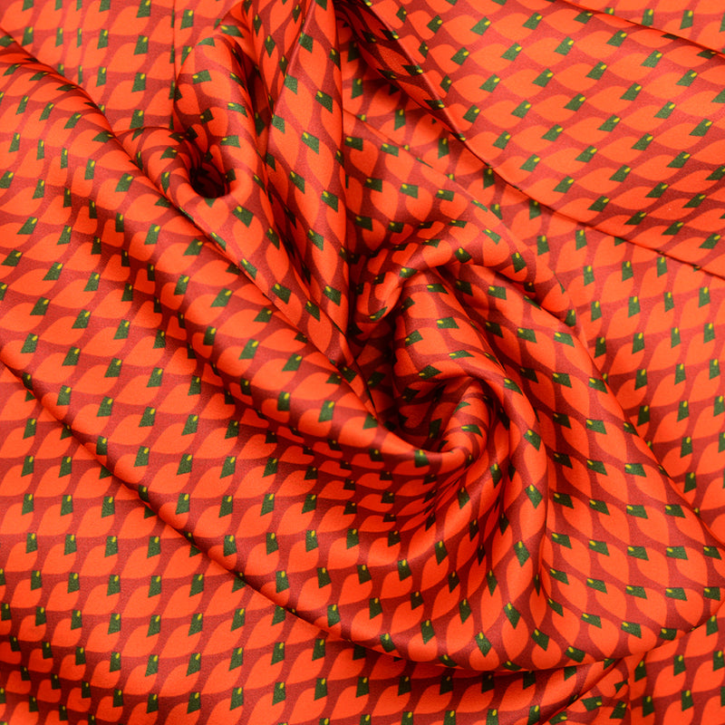 Satin de soie imprimé vive les feuilles orange fond rouge