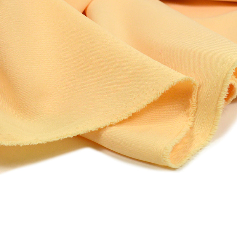 Tissu burlington polyester pêche jaune