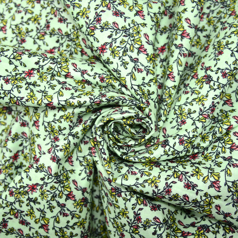 Torbellino de estampado de algodón de flores verdes