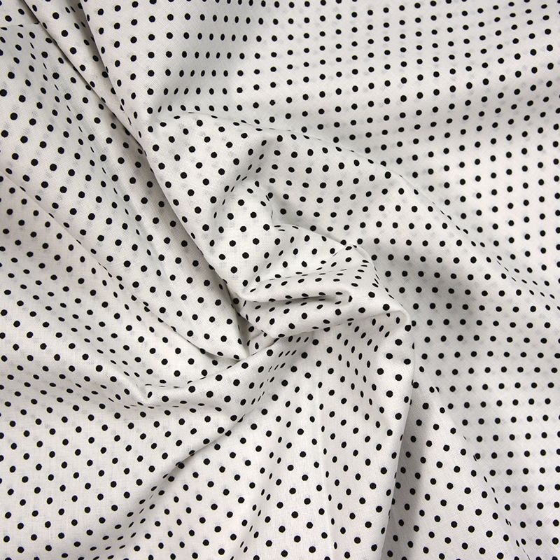 Coton imprimé petit pois noir fond blanc
