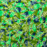 Cotton print whirlwind of green flowers