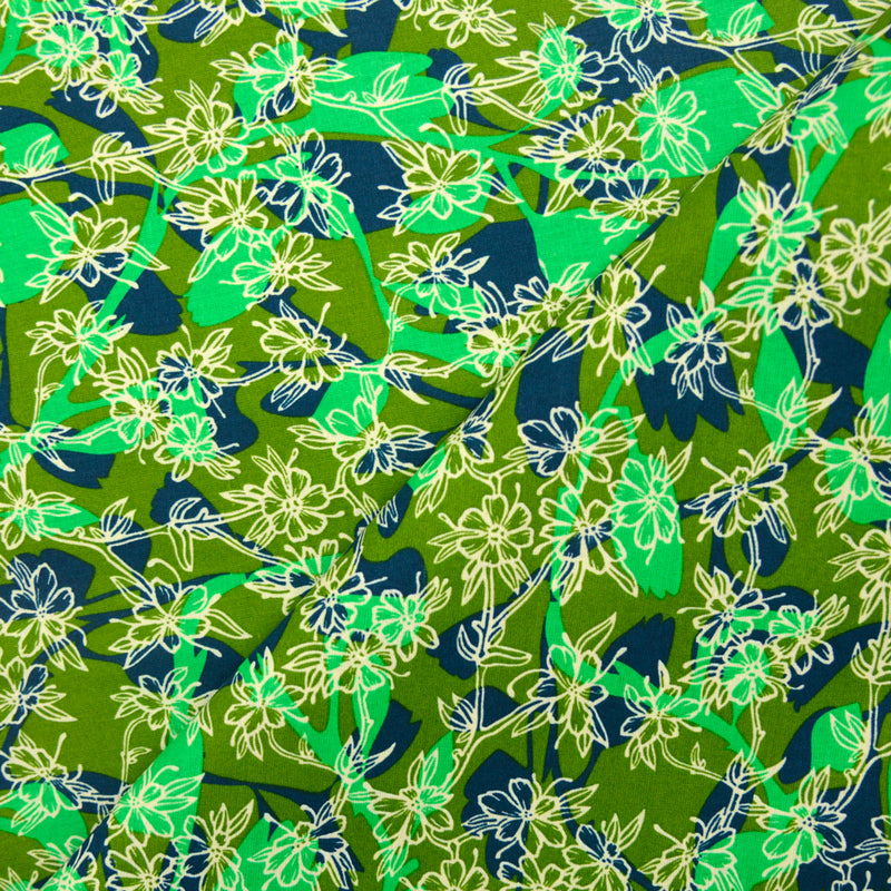 Cotton print whirlwind of green flowers
