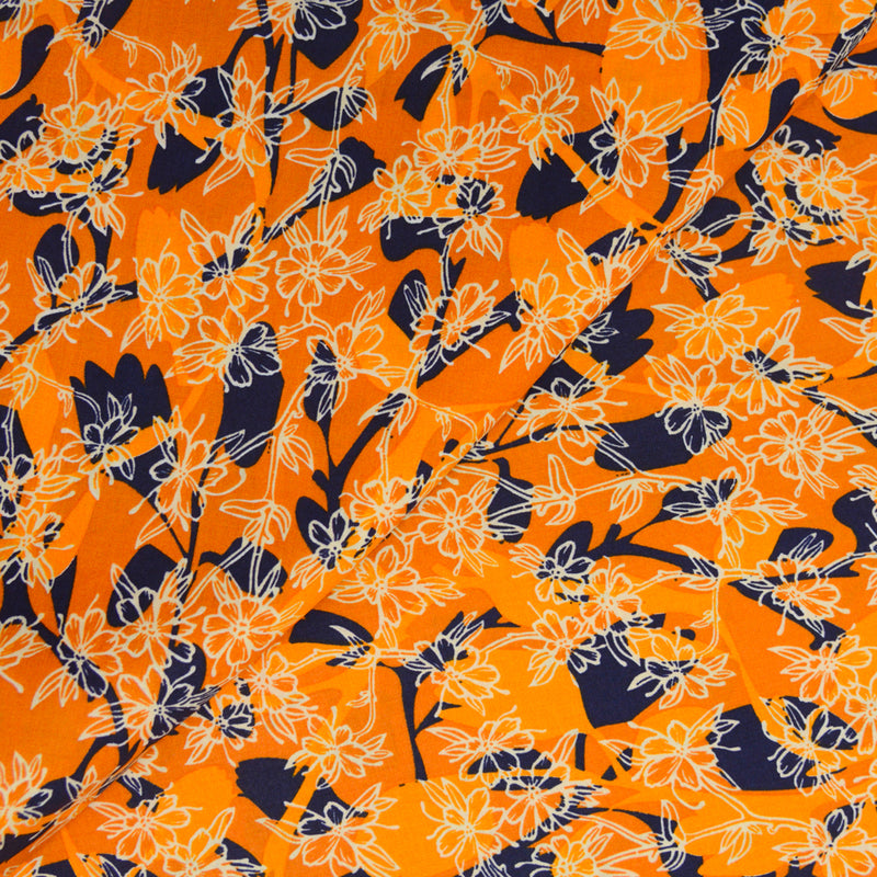 Coton imprimé danse des fleurs fond orange