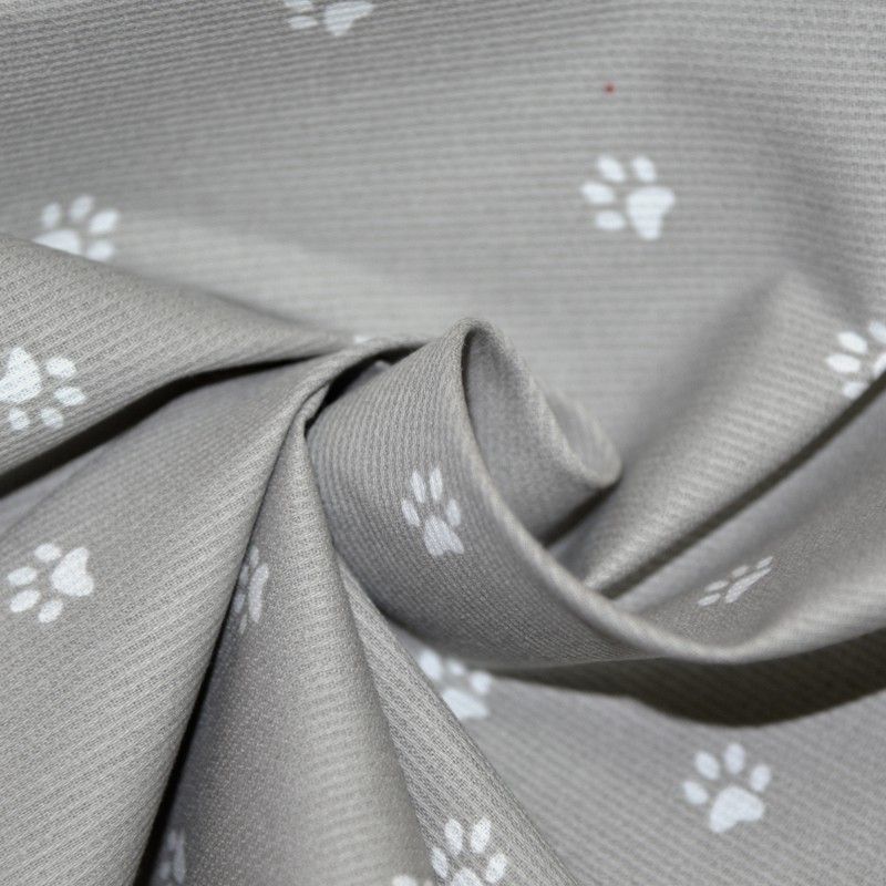 Piqué de coton imprimé pattes de chien blanches sur fond gris Coupon 45x45 cm