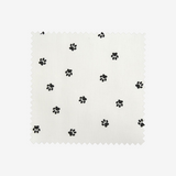 Piqué de coton imprimé pattes de chien noires sur fond blanc Coupon 45x45 cm
